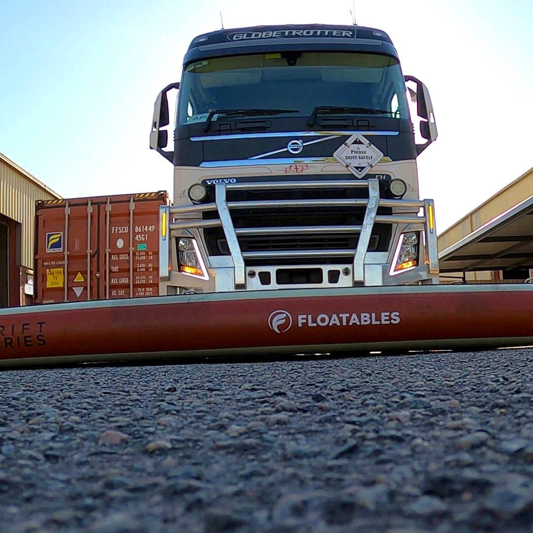 Load testing an inflatable Floatables pontoon with a 40ft container and truck